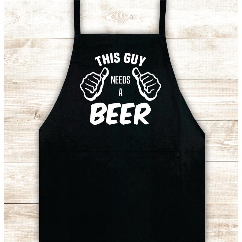 This Guy Needs A Beer Apron Kitchen Cook Grill Bake BBQ Barbeque Chef Men Women Mom Dad Family Food Gift Funny